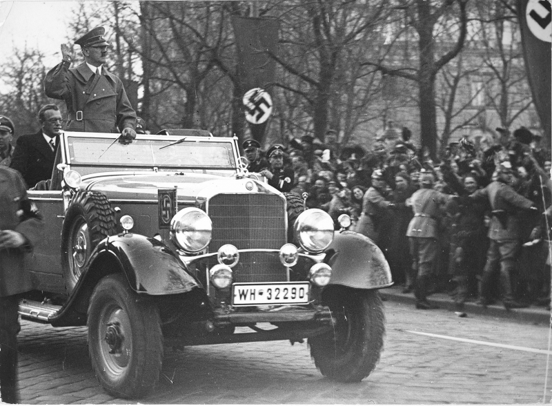 Adolf Hitler enters Vienna with Arthur Seyss-Inquart in the back seat